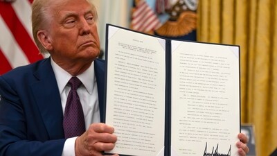 President Donald Trump holds up a signed executive order aiming to declassify remaining federal records relating to the assassinations of President John F. Kennedy, Sen. Robert F. Kennedy, and Martin Luther King Jr., in the Oval Office of the White House, Thursday, Jan. 23, 2025, in Washington. (AP Photo/Ben Curtis) (AP) President Donald Trump holds up a signed executive order aiming to declassify remaining federal records relating to the assassinations of President John F. Kennedy, Sen. Robert F. Kennedy, and Martin Luther King Jr., in the Oval Office of the White House, Thursday, Jan. 23, 2025, in Washington. (AP Photo/Ben Curtis) (AP)