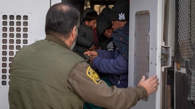Immigrants prepare to be transported by the US Border Patrol after crossing the US-Mexico border on January 20, 2025 near Sasabe, Arizona. (Getty Images via AFP) Immigrants prepare to be transported by the US Border Patrol after crossing the US-Mexico border on January 20, 2025 near Sasabe, Arizona. (Getty Images via AFP)