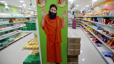 A hoarding with an image of Baba Ramdev is seen inside a Patanjali store in Ahmedabad, India. (Reuters)