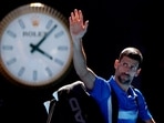Novak Djokovic waves to the crowd as he leaves the court after retiring from his semi final match against Germany's Alexander Zverev