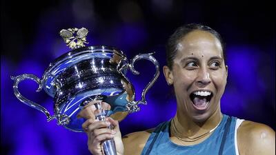 American Madison Keys celebrates with the Australian Open trophy after winning her first Grand Slam singles title in Melbourne on Saturday. (REUTERS) American Madison Keys celebrates with the Australian Open trophy after winning her first Grand Slam singles title in Melbourne on Saturday. (REUTERS)