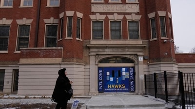 A person walks by Hamline Elementary School after federal agents were turned away on Friday, Jan. 24, 2025, in Chicago. (AP Photo/Erin Hooley) (AP) A person walks by Hamline Elementary School after federal agents were turned away on Friday, Jan. 24, 2025, in Chicago. (AP Photo/Erin Hooley) (AP)