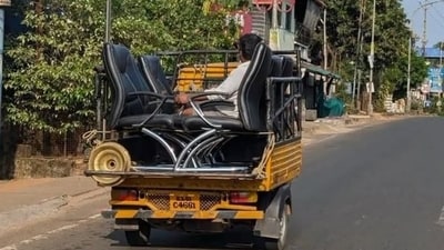 A small luggage truck carrying office rolling chairs, with one man sitting on a chair among them. (X/@Adarsh_Web3) A small luggage truck carrying office rolling chairs, with one man sitting on a chair among them. (X/@Adarsh_Web3)