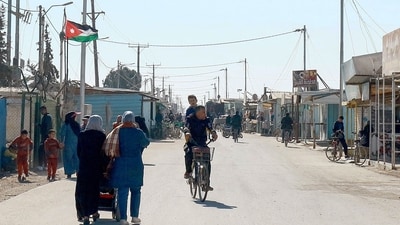 People walk down a street at the Zaatari camp for Syrian refugees, near the Jordanian city of Mafraq, about 80Km north of the capital Amman on January 13, 2025. (AFP) People walk down a street at the Zaatari camp for Syrian refugees, near the Jordanian city of Mafraq, about 80Km north of the capital Amman on January 13, 2025. (AFP)