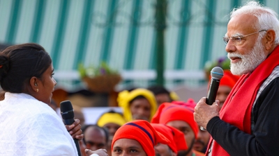 Prime Minister Narendra Modi engaged with NCC Cadets, NSS Volunteers, Tribal visitors, and Tableaux Artists who will participate in the forthcoming Republic Day parade. (PTI) Prime Minister Narendra Modi engaged with NCC Cadets, NSS Volunteers, Tribal visitors, and Tableaux Artists who will participate in the forthcoming Republic Day parade. (PTI)
