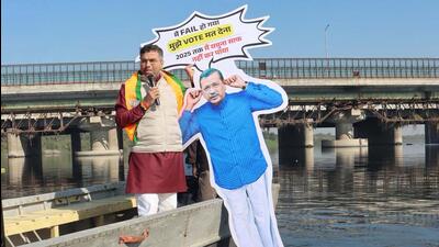 Parvesh Verma immerses a cutout of AAP chief Arvind Kejriwal in the Yamuna on Saturday. (HT Photo) Parvesh Verma immerses a cutout of AAP chief Arvind Kejriwal in the Yamuna on Saturday. (HT Photo)