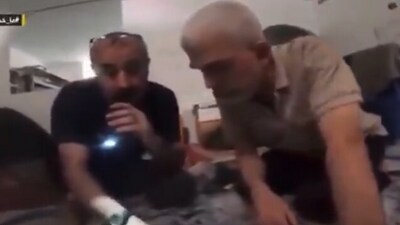 Yahya Sinwar (right) in the footage released by Al Jazeera. Yahya Sinwar (right) in the footage released by Al Jazeera.