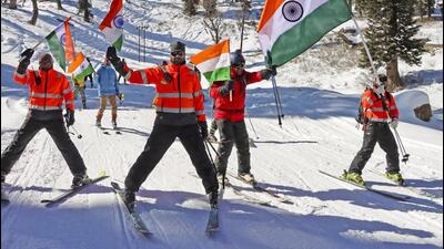 Security personnel take part in a 'Tiranga Yatra' at a ski resort ahead of Republic Day, at Gulmarg, in north Kashmir, on Saturday. (PTI) Security personnel take part in a 'Tiranga Yatra' at a ski resort ahead of Republic Day, at Gulmarg, in north Kashmir, on Saturday. (PTI)