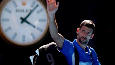 Novak Djokovic waves to the crowd as he leaves the court after retiring from his semi final match against Germany's Alexander Zverev (REUTERS)