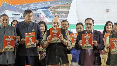Union home minister Amit Shah along with other BJP leaders releases the third and final part of the party’s manifesto for the upcoming Delhi Assembly elections, in Delhi, on Saturday. (PTI) Union home minister Amit Shah along with other BJP leaders releases the third and final part of the party’s manifesto for the upcoming Delhi Assembly elections, in Delhi, on Saturday. (PTI)