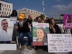 Families and supporters of Israeli hostages held by Hamas in Gaza, hold photos of their loved ones during a protest calling for their release outside the prime minister's office in Jerusalem, Sunday, Jan. 26, 2025. Families and supporters of Israeli hostages held by Hamas in Gaza, hold photos of their loved ones during a protest calling for their release outside the prime minister's office in Jerusalem, Sunday, Jan. 26, 2025.
