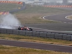 Lewis Hamilton drives a Ferrari F1 car around the Fiorano circuit.