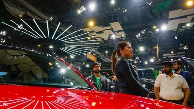 A model poses with a Skoda car at the Bharat Mobility Global Expo. (PTI) A model poses with a Skoda car at the Bharat Mobility Global Expo. (PTI)