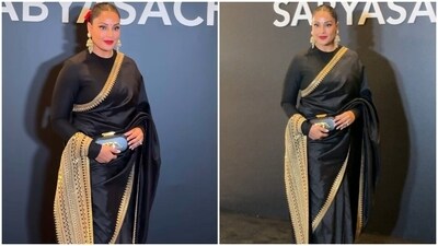 Bipasha Basu, too, chose a silk saree for Sabyasachi's runway show. She wore a black silk saree adorned with zardozi embroidery. A full-sleeves silk blouse, statement gold jhumkis, rose-adorned bun, red lips, and striking glam rounded off her look. Bipasha Basu, too, chose a silk saree for Sabyasachi's runway show. She wore a black silk saree adorned with zardozi embroidery. A full-sleeves silk blouse, statement gold jhumkis, rose-adorned bun, red lips, and striking glam rounded off her look. 