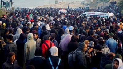 Palestinians wait to be allowed to return to their homes in northern Gaza after they were displaced to the south at Israel's order during the war, amid a ceasefire between Israel and Hamas, in the central Gaza Strip, January 26, 2025. (REUTERS)