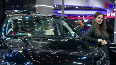 A model poses with a Maruti car at the Bharat Mobility Global Expo 2025. (PTI) A model poses with a Maruti car at the Bharat Mobility Global Expo 2025. (PTI)