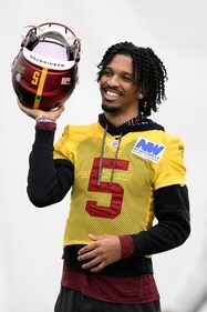 Washington Commanders quarterback Jayden Daniels reacts during NFL football practice on Friday. (AP) Washington Commanders quarterback Jayden Daniels reacts during NFL football practice on Friday. (AP)
