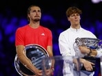 Italy's Jannik Sinner poses with the trophy alongside Germany's Alexander Zverev after the final