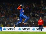 India's Tilak Varma celebrates after hitting four runs to win the game against England.