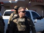 U.S. Immigrations and Customs (ICE) Homeland Security Investigations (HSI) agents take part in detaining two documented immigrants with prior convictions at a Home Depot parking lot in Tucson, Arizona, U.S., January 26, 2025.    REUTERS/Rebecca Noble