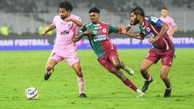 Mohun Bagan Super Giant’s Liston Colaco (second from left) and Subhasish Bose try to deny Bengaluru FC’s Nikhil Poojary at Salt Lake stadium on Monday. (ISL) Mohun Bagan Super Giant’s Liston Colaco (second from left) and Subhasish Bose try to deny Bengaluru FC’s Nikhil Poojary at Salt Lake stadium on Monday. (ISL)