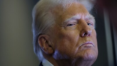 FILE PHOTO: U.S. President Donald Trump looks on as reporters ask questions aboard Air Force One during a flight from Las Vegas, Nevada, to Miami, Florida. (REUTERS)