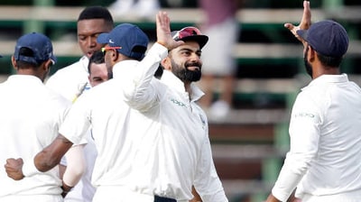 Virat Kohli celebrates with Cheteshwar Pujara as India beat South Africa in the third Test at the Wanderers Stadium in 2018. (Getty Images)