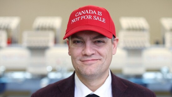 Liam Mooney, CEO and strategic leader of Jackpine Dynamic Branding and creator of the Canada is not for sale cap, poses for a portrait at the Sam Group on January 16, 2025 in Ottawa, Canada (Photo by Dave Chan / AFP) (AFP)