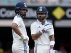 India's Virat Kohli (R) talks to KL Rahul between the overs on day three of the third Test match between Australia and India India's Virat Kohli (R) talks to KL Rahul between the overs on day three of the third Test match between Australia and India