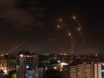 Rockets fired from Gaza and intercepted by Israel's Iron Dome anti-missile system over Israeli skies are seen from Gaza City, on May 13, 2023. Rockets fired from Gaza and intercepted by Israel's Iron Dome anti-missile system over Israeli skies are seen from Gaza City, on May 13, 2023.
