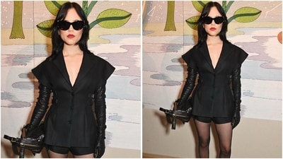 Jenna Ortega arrived in a sleeveless jacket and micro shorts, pairing the look with sheer tights, cat-eye frames, and open-toe satin pumps. (AP photo) Jenna Ortega arrived in a sleeveless jacket and micro shorts, pairing the look with sheer tights, cat-eye frames, and open-toe satin pumps. (AP photo)