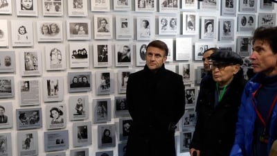 French President Emmanuel Macron together with French-Israeli jurist Arno Klarsfeld and his father, French activist and Nazi hunter Serge Klarsfeld visited a gallery of photographs of the permanent exhibition in the French block of the Auschwitz concentration camp site (Ludovic Marin/AFP) French President Emmanuel Macron together with French-Israeli jurist Arno Klarsfeld and his father, French activist and Nazi hunter Serge Klarsfeld visited a gallery of photographs of the permanent exhibition in the French block of the Auschwitz concentration camp site (Ludovic Marin/AFP)