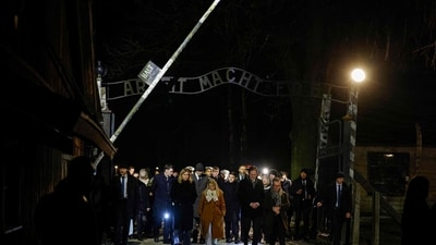 French President Emmanuel Macron is seen here walking through a gate with the lettering in German "Arbeit Macht Frei" (Work Will Set You Free), at the extermination camp Auschwitz-Birkenau set up by the Red Army in southern Poland in 1940. (Ludovic Marin/AFP) French President Emmanuel Macron is seen here walking through a gate with the lettering in German "Arbeit Macht Frei" (Work Will Set You Free), at the extermination camp Auschwitz-Birkenau set up by the Red Army in southern Poland in 1940. (Ludovic Marin/AFP)
