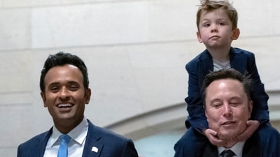Speaker of the House Mike Johnson walks with Vivek Ramaswamy and Elon Musk, who is carrying his son X Æ A-Xii, as they walk to a meeting to discuss President-elect Donald Trump's planned Department of Government Efficiency, on Capitol Hill in Washington, (AP) Speaker of the House Mike Johnson walks with Vivek Ramaswamy and Elon Musk, who is carrying his son X Æ A-Xii, as they walk to a meeting to discuss President-elect Donald Trump's planned Department of Government Efficiency, on Capitol Hill in Washington, (AP)