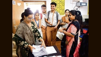 Mumbai, India – 28, Jan 2025: The first batch of CBSE and ICSE students from schools run by the BMC will be appearing for board examinations this year, Principal of ICSE school is distributing hall tickets to the parents, at Dadar Woolen Mill School, in Mumbai, India, on Tuesday, Jan 28, 2025. (Photo by Bhushan Koyande/HT Photo) Mumbai, India – 28, Jan 2025: The first batch of CBSE and ICSE students from schools run by the BMC will be appearing for board examinations this year, Principal of ICSE school is distributing hall tickets to the parents, at Dadar Woolen Mill School, in Mumbai, India, on Tuesday, Jan 28, 2025. (Photo by Bhushan Koyande/HT Photo)