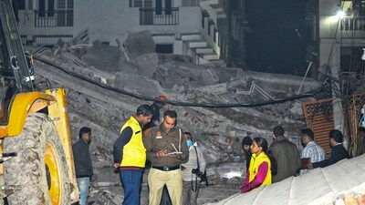 Police at the site of the building collapse in Burari (PTI) Police at the site of the building collapse in Burari (PTI)