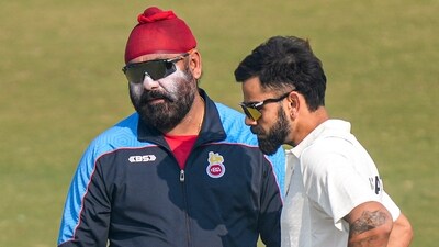 Delhi's player Virat Kohli with team coach Sarandeep Singh during a training session ahead of the Ranji Trophy 2024-25 cricket match between Delhi and Railways, at the Arun Jaitley Stadium, in New Delhi (PTI) Delhi's player Virat Kohli with team coach Sarandeep Singh during a training session ahead of the Ranji Trophy 2024-25 cricket match between Delhi and Railways, at the Arun Jaitley Stadium, in New Delhi (PTI)