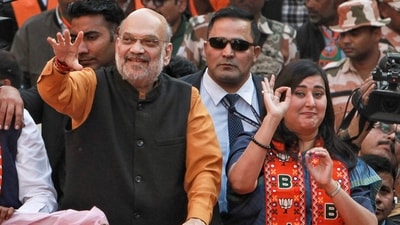 Union home minister and BJP leader Amit Shah with party MP Bansuri Swaraj during a roadshow in support of party candidate Neeraj Basoya ahead of Delhi assembly election in New Delhi on Tuesday (PTI) Union home minister and BJP leader Amit Shah with party MP Bansuri Swaraj during a roadshow in support of party candidate Neeraj Basoya ahead of Delhi assembly election in New Delhi on Tuesday (PTI)
