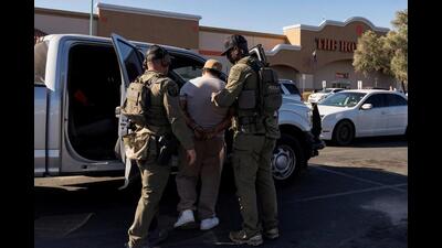 US Immigrations and Customs (ICE) Homeland Security Investigations (HSI) agents detain a person in Tucson, Arizona. (Reuters File)