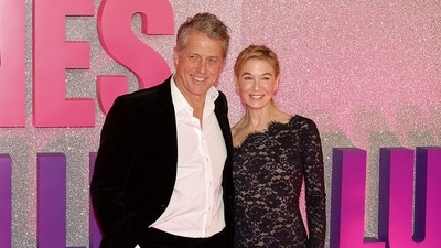 Renee Zellweger (R) and Hugh Grant pose upon arrival for a photocall ahead of the French premiere of the film Bridget Jones: Mad About the Boy, at Le Grand Rex cinema in Paris. (Photo by Sebastien DUPUY / AFP) (AFP) Renee Zellweger (R) and Hugh Grant pose upon arrival for a photocall ahead of the French premiere of the film Bridget Jones: Mad About the Boy, at Le Grand Rex cinema in Paris. (Photo by Sebastien DUPUY / AFP) (AFP)