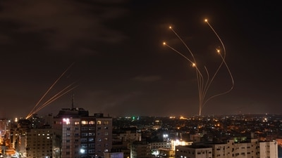 Rockets fired from Gaza and intercepted by Israel's Iron Dome anti-missile system over Israeli skies are seen from Gaza City, on May 13, 2023. (AP) Rockets fired from Gaza and intercepted by Israel's Iron Dome anti-missile system over Israeli skies are seen from Gaza City, on May 13, 2023. (AP)