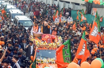 Union home minister Amit Shah holds a roadshow in support of BJP's candidate from Kasturba Nagar assembly constituency Neeraj Basoya for the Delhi assembly election in New Delhi on Tuesday. (ANI) Union home minister Amit Shah holds a roadshow in support of BJP's candidate from Kasturba Nagar assembly constituency Neeraj Basoya for the Delhi assembly election in New Delhi on Tuesday. (ANI)
