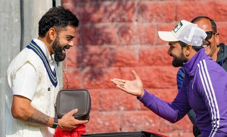 New Delhi: Delhi's player Virat Kohli shares a light moment with his former cricket mate Shavez during a training session (PTI) New Delhi: Delhi's player Virat Kohli shares a light moment with his former cricket mate Shavez during a training session (PTI)