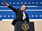 Tesla and SpaceX CEO Elon Musk gestures as he speaks during the inaugural parade inside Capitol One Arena, in Washington, DC, on January 20, 2025. Tesla and SpaceX CEO Elon Musk gestures as he speaks during the inaugural parade inside Capitol One Arena, in Washington, DC, on January 20, 2025.