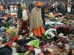 Pilgrims look for their belongings at the site of a stampede amid the ongoing Maha Kumbh Mela festival in Prayagraj.