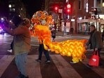 Local residents in a lion costume perform during the celebration on the eve of the Lunar New Year in the area known as Chinatown in Washington, U.S. January 28, 2025. REUTERS/Carlos Barria
