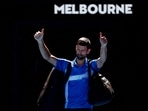 Serbia's Novak Djokovic gestures to the crowd as he leaves the court after retiring from his semi final match against Germany's Alexander Zverev 