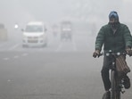 Commuters step out on a cold foggy morning amid rising air pollution. Commuters step out on a cold foggy morning amid rising air pollution.