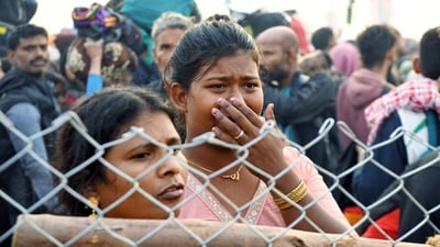 A devotee breaks down during a stampede before the 'Amrit Snan' on the occasion of Mauni Amavasya during the Mahakumbh 2025 in Prayagraj on Wednesday. (ANI) A devotee breaks down during a stampede before the 'Amrit Snan' on the occasion of Mauni Amavasya during the Mahakumbh 2025 in Prayagraj on Wednesday. (ANI)