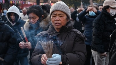Millions of people across the world bid farewell to the Year of the Dragon and usher in the Year of the Snake. (Photo by GREG BAKER / AFP) (AFP) Millions of people across the world bid farewell to the Year of the Dragon and usher in the Year of the Snake. (Photo by GREG BAKER / AFP) (AFP)